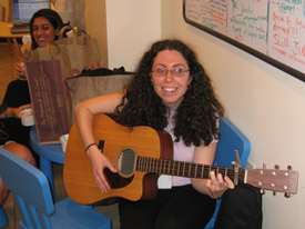 Customer playing guitar at Mr. Yogato